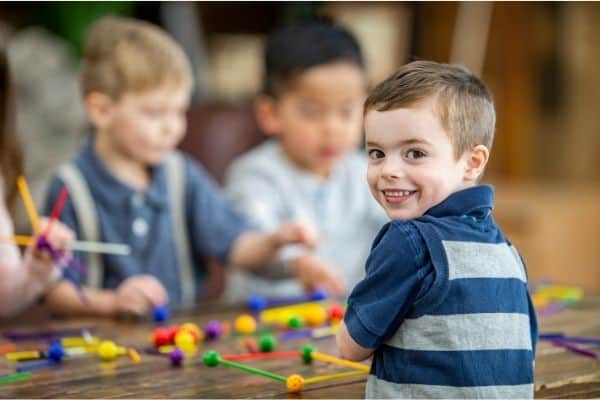 Young boys playing with STEM toys