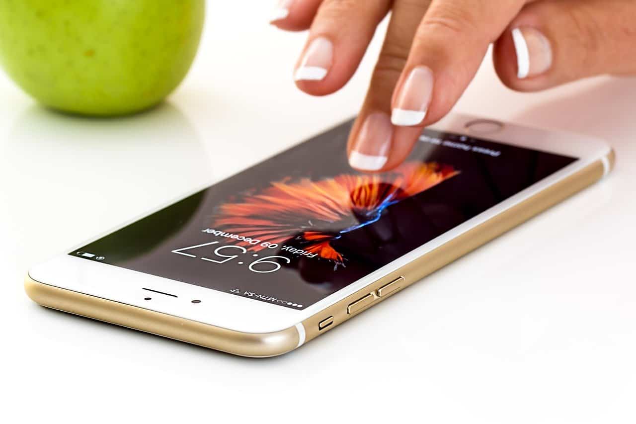 Woman's hand scrolling smartphone with fingertips