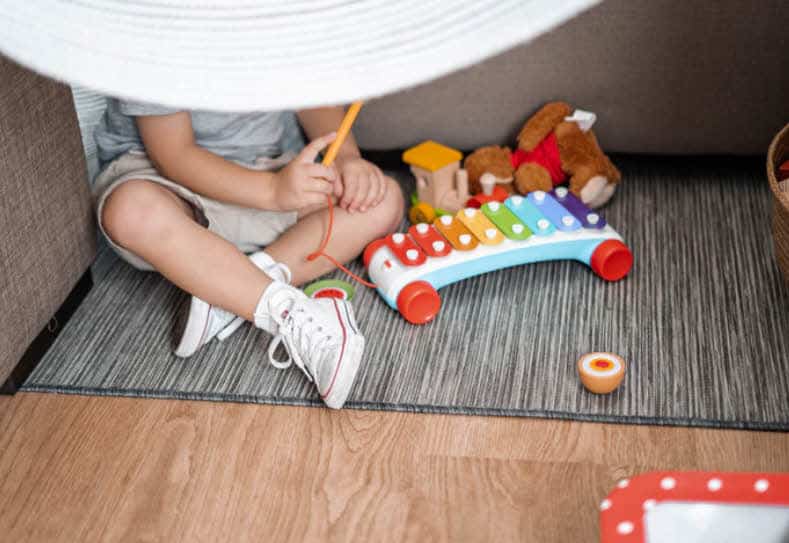 Kid playing with xylophone