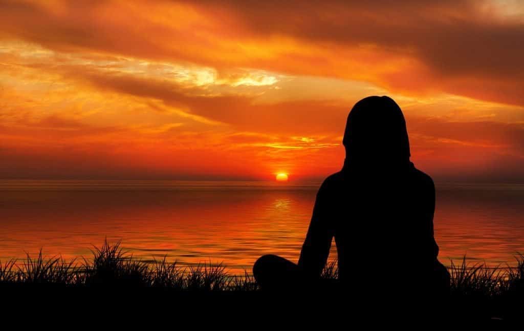 Woman looking into the sunset