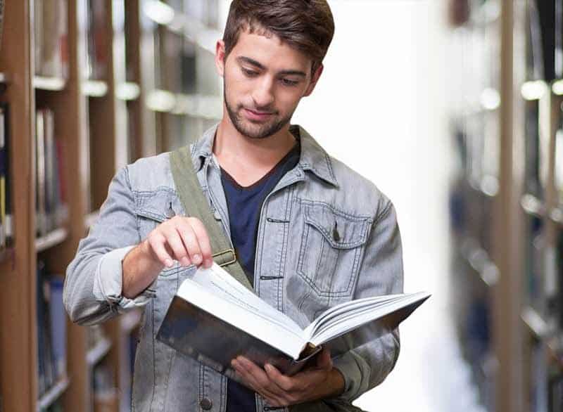 Man flipping through book