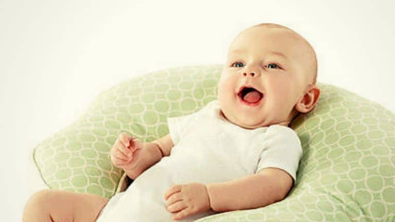 Top 3 Best Breastfeeding Pillows for Australian Nursing Mums - happy baby in a nursing cushion