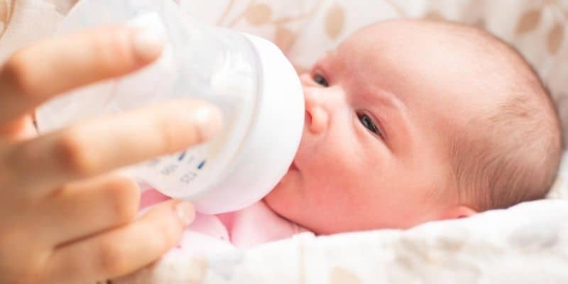 Newborn baby drinking formula milk