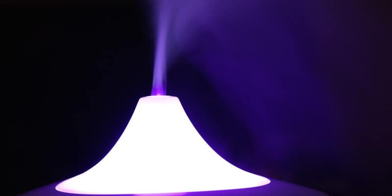 glowing humidifier releasing mist in the air
