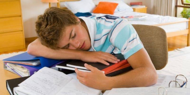teenager fell asleep after doing homework