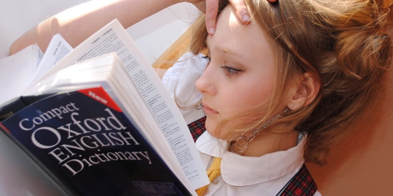 Girl reading dictionary