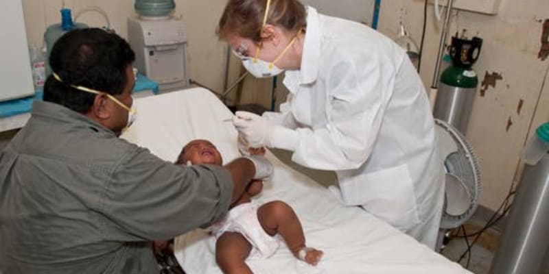 Father and baby with friendly doctor