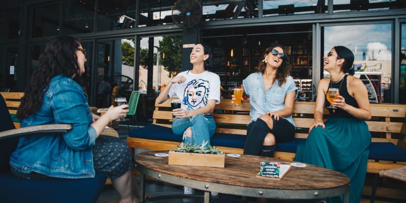 Group of women happily talking to each other