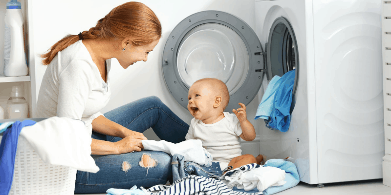 Mother and baby doing laundry