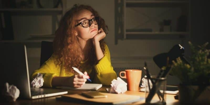 Worried woman writing