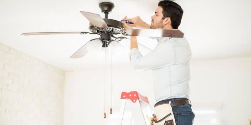 Man installing ceiling fan