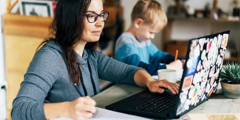 Mom working beside son