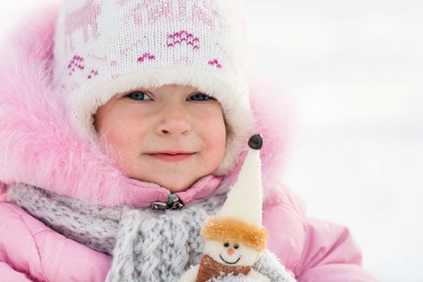 Baby wearing hooded jacket beanie and scarf to keep warm