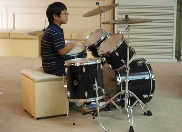 Boy playing the drum
