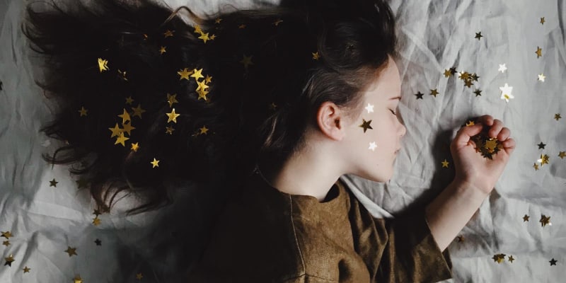 Child asleep after playing with stars