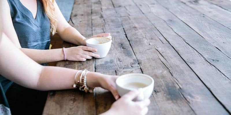 People talking over a cup of coffee