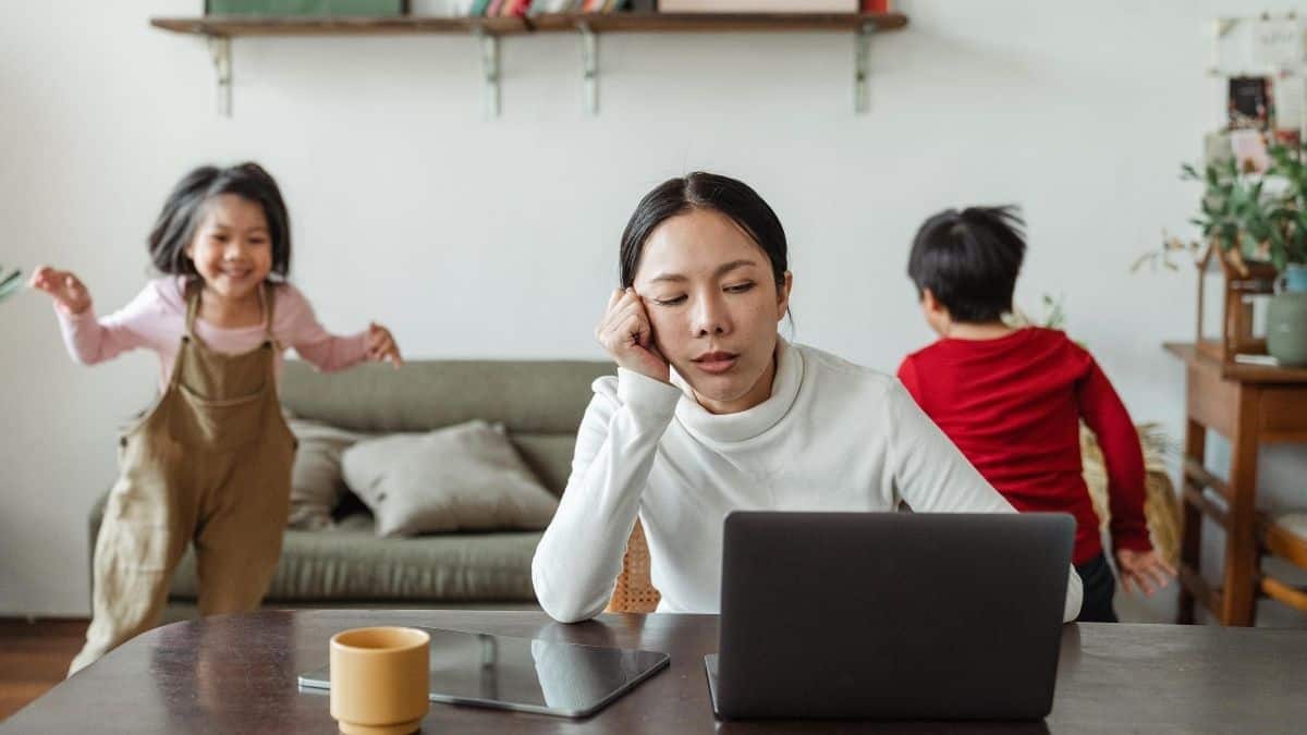 Work at home mum with kids in the background