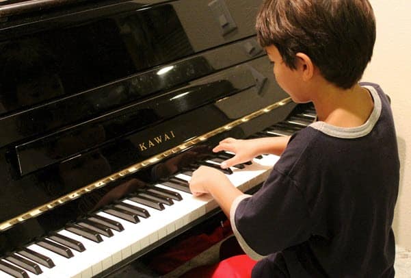boy playing piano