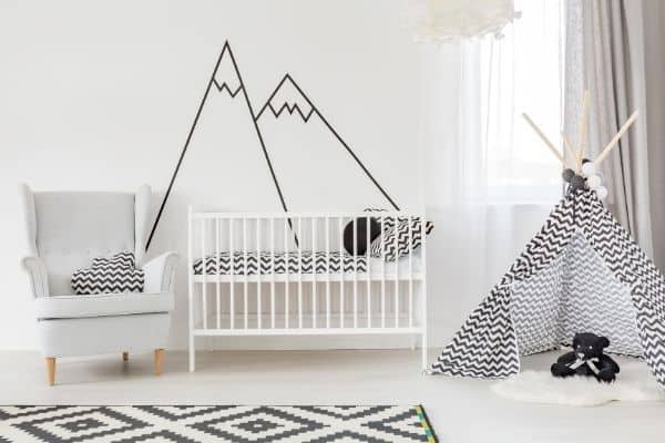 A baby nursery with stylish baby cot