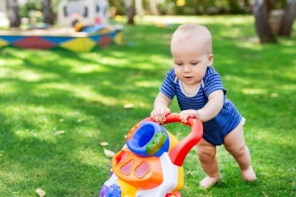 Child on a roller walker playing outdoors
