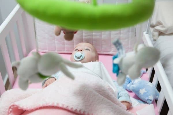 Baby on a comfortable cot
