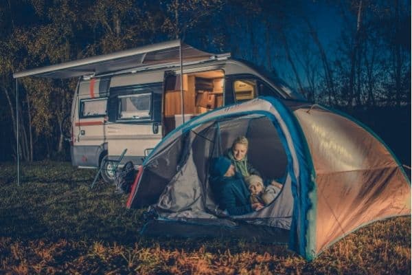 Family in a tent on a caravan park