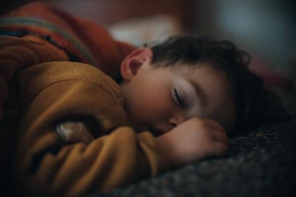 Child sleeping at night with the lights out