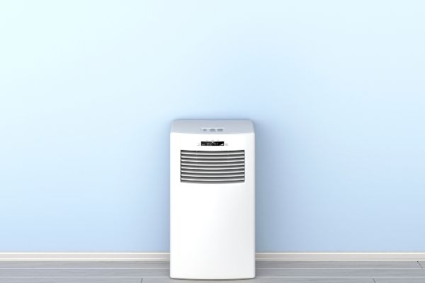 Portable air conditioner in a blue room