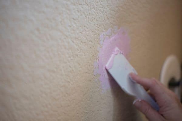 plastering a hole in the wall