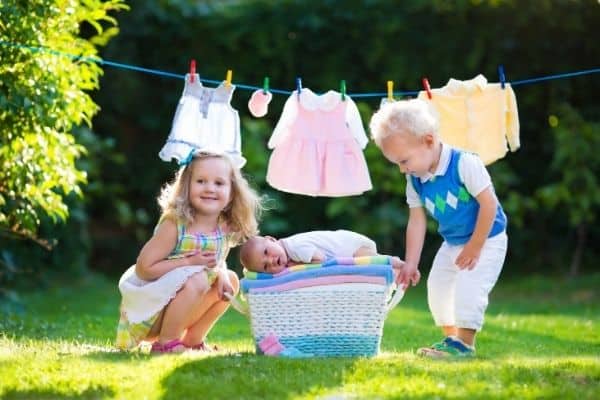 Kids and newborn in the backyard