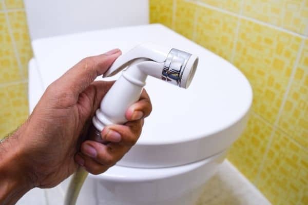 Man holding a bidet