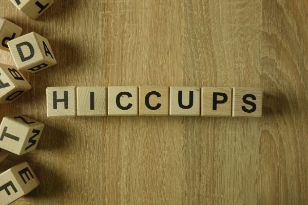 Hiccups spelled on wooden letter blocks