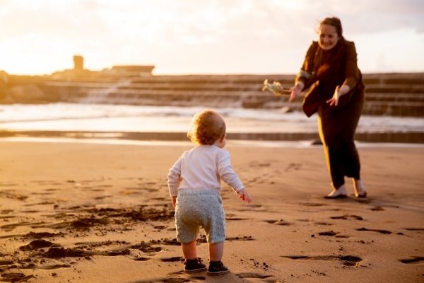 Mother and child playing under the sun
