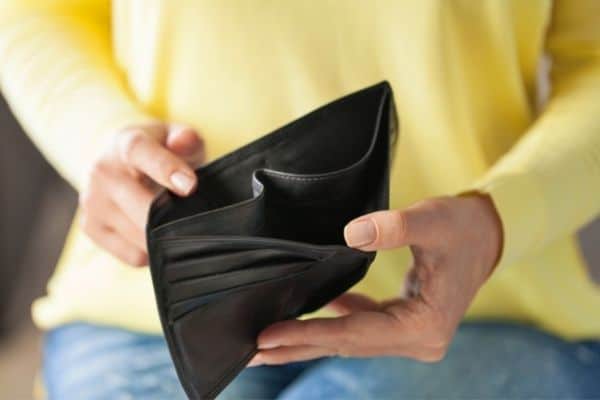 person holding new leather wallet
