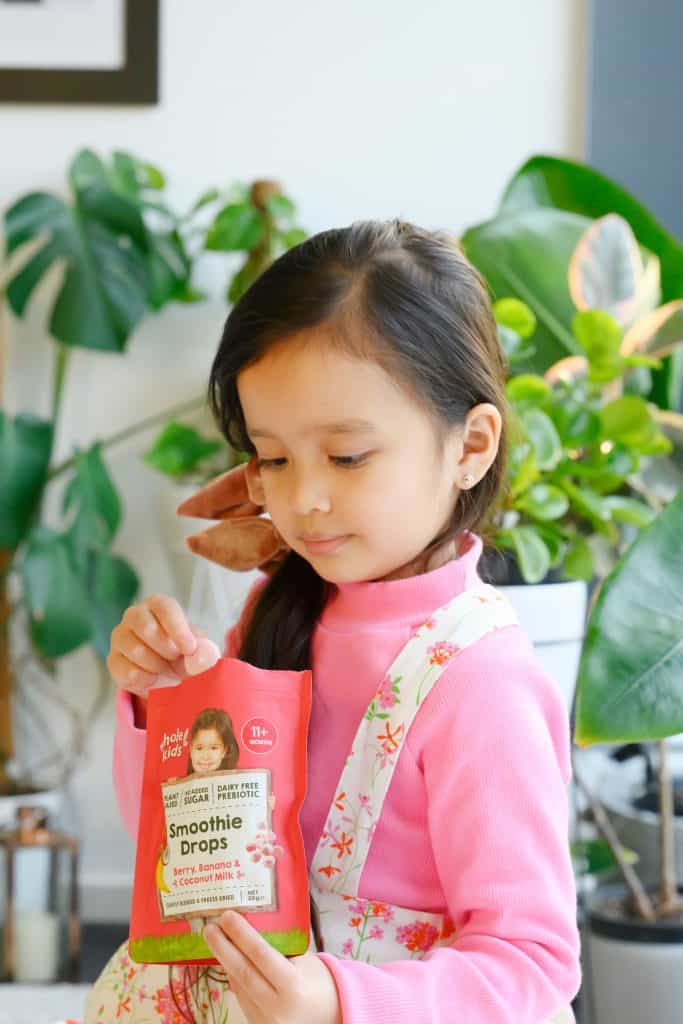Young child eating Smoothie Drop
