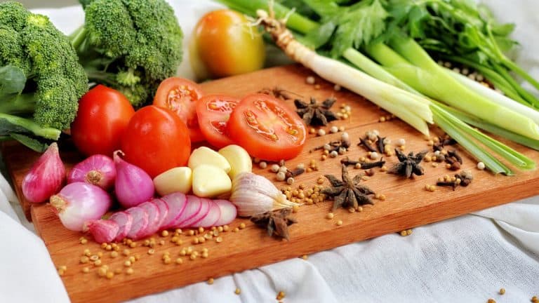 Top healthiest foods laid out on a wooden cutting board