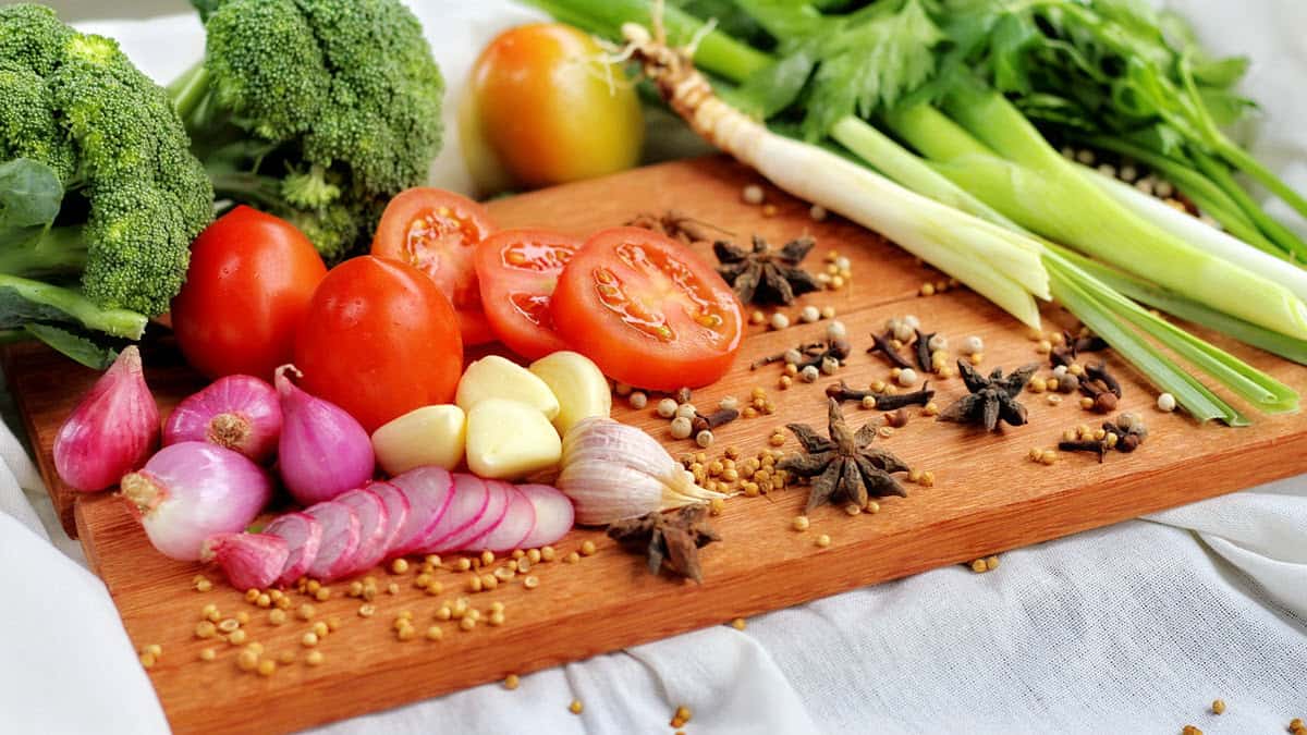 Top healthiest foods laid out on a wooden cutting board