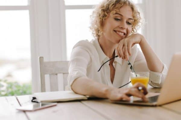 happy working person in front of computer