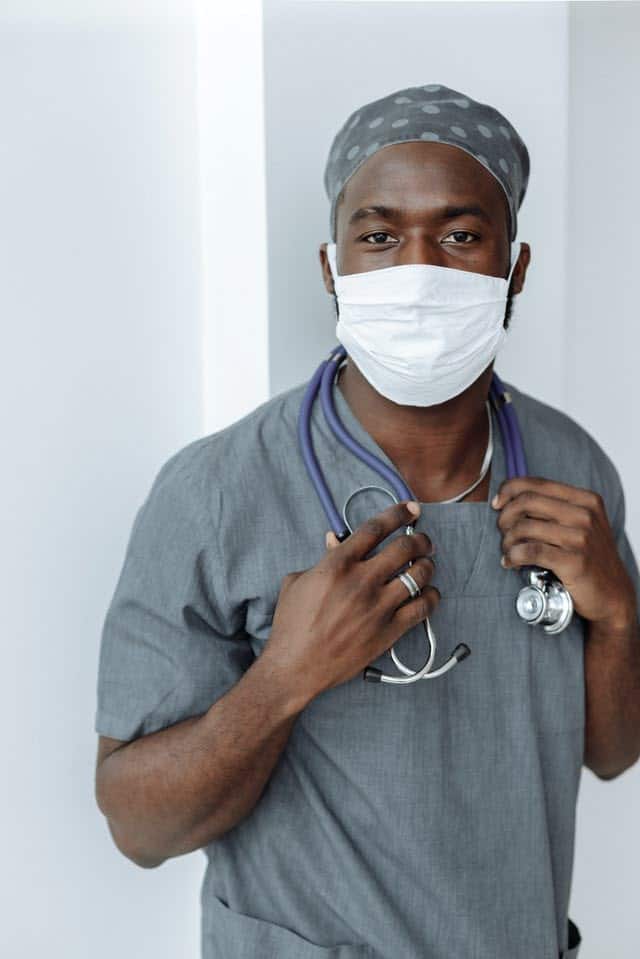Male doctor with mask and stethoscope