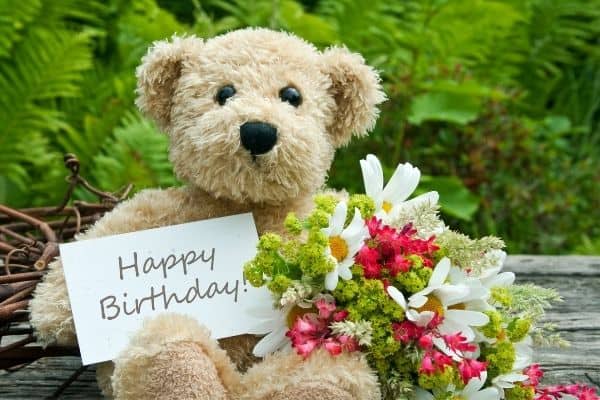 birthday flowers and teddy bear