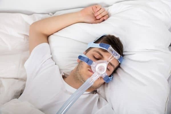 person using CPAP machine