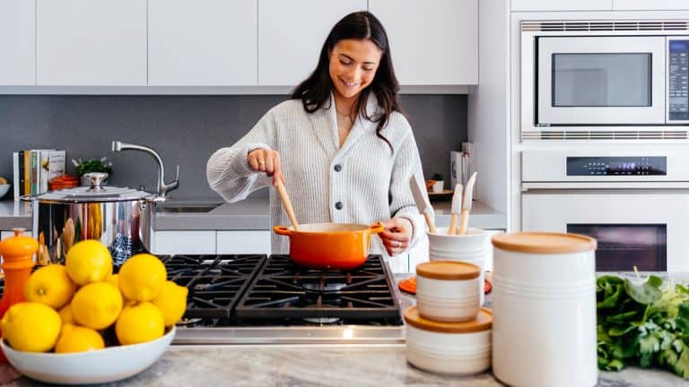 Dark haired woman cooking in a kitchen