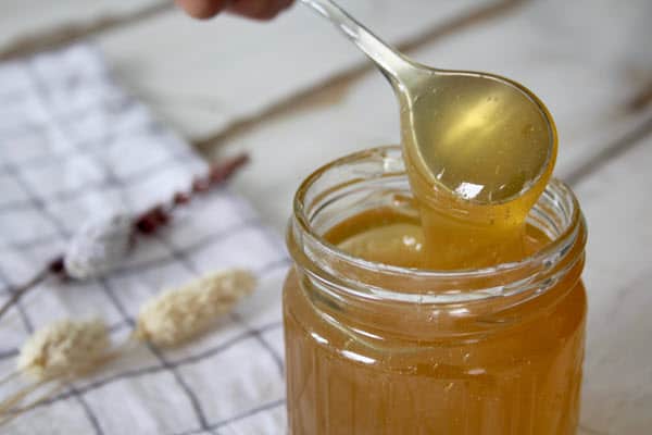Teaspoon in honey jar