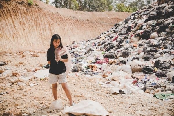child collecting garbage