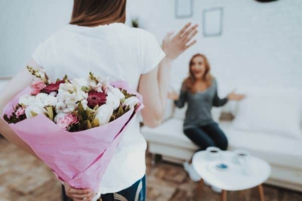 daughter with flower for mother