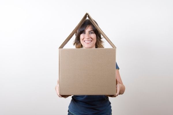 woman holding moving box