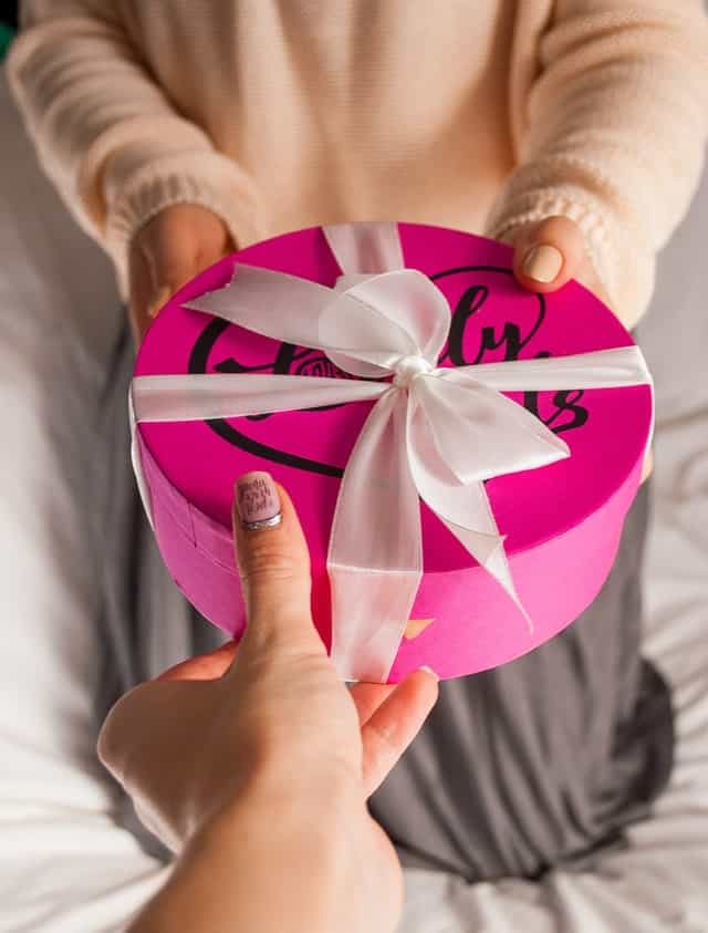 Mother giving gift to daughter