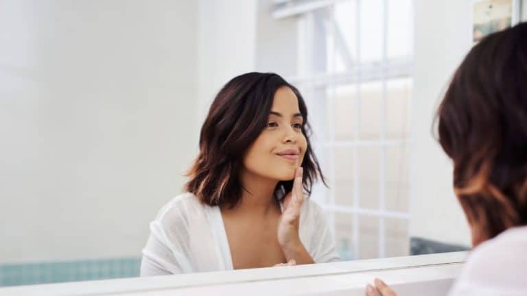 woman in front of a mirror