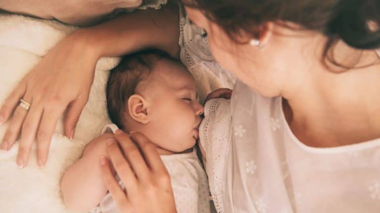 New mother breastfeeding baby