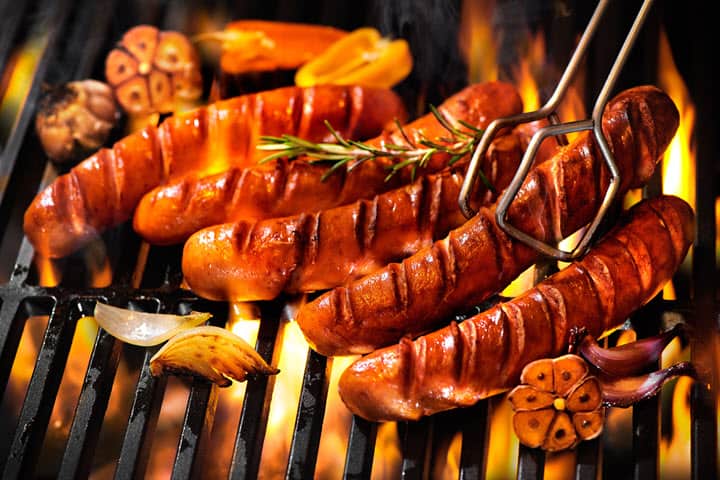 Smokies on a barbecue